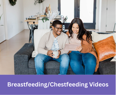 a smiling couple on a couch looks at a tablet