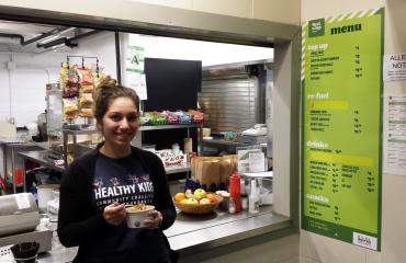 Person eating from the healthy choices menu