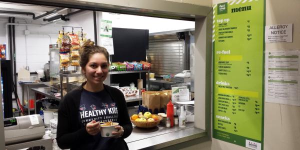 Person eating from the healthy choices menu