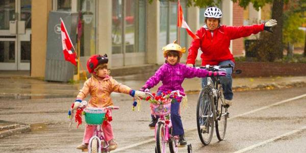 Mom Riding with Kids to School