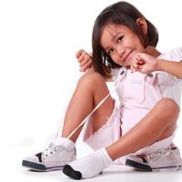 Girl Tying shoe