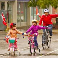 Mom Riding with Kids to School