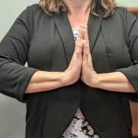 Woman doing Namaste sign