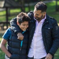 Father and Son walking in park