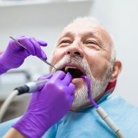 Senior receiving dental care