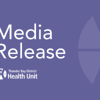a purple tile with 'Media Release' in large type and the TBDHU logo